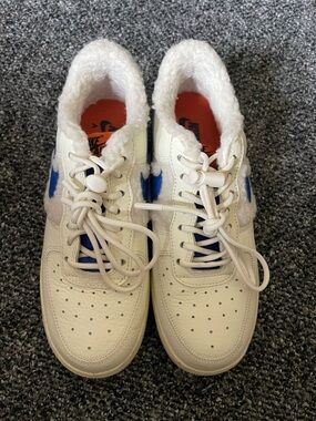White Sneakers with Blue Swoosh Detail